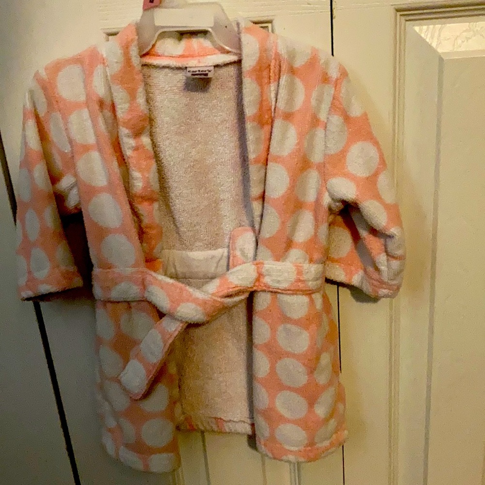It's made by Carter's, it's is, it's cotton, it's only used a handful of times
